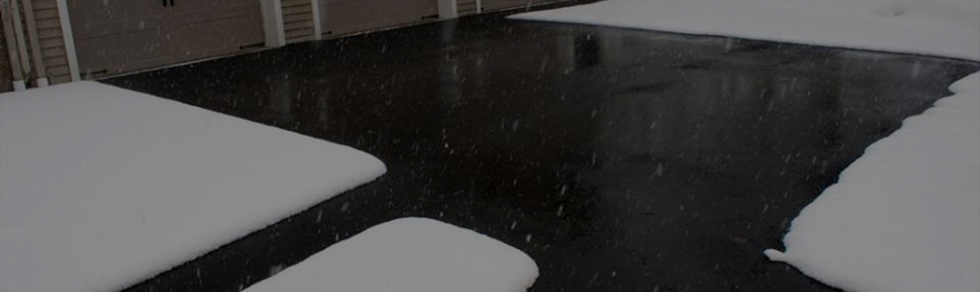 A heated driveway in operation during a storm